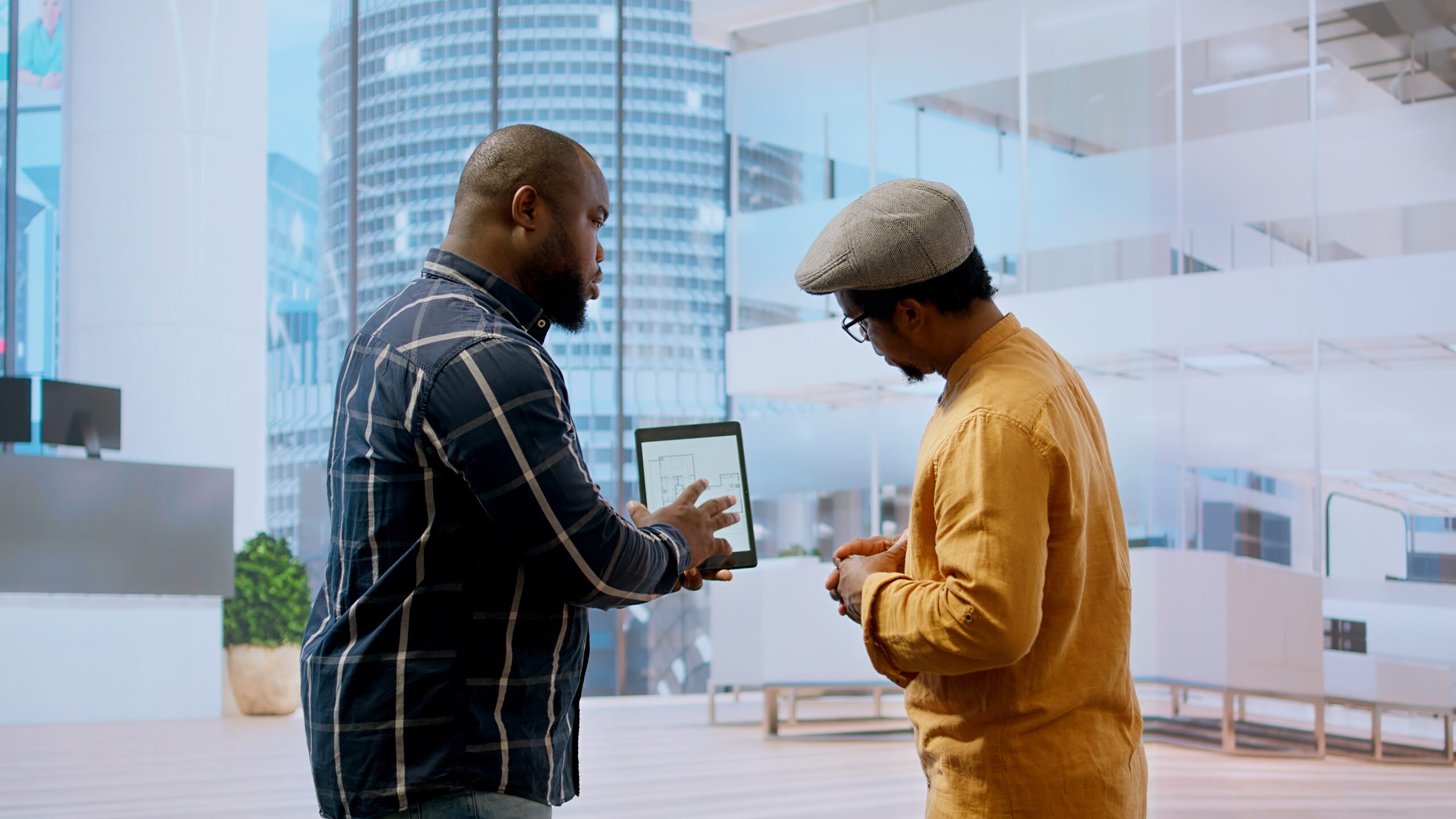 The Use of AI in Brand Collaborations - Two men brainstorming on the right influencers with the help of AI.